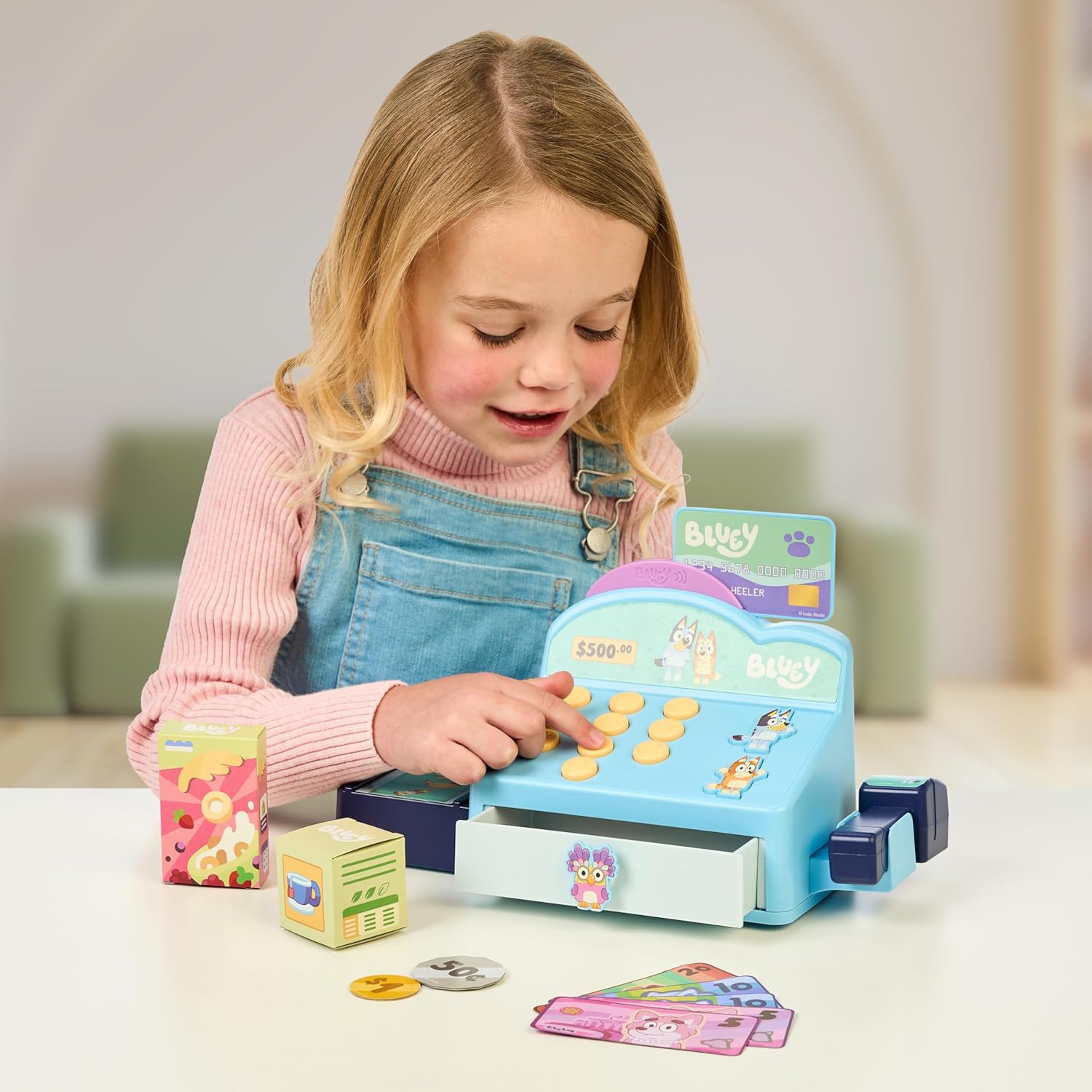 Cash Register. Press the Buttons to Hear Beeps, Sounds and Phrases from  and Bingo |Use the Scanner to Scan Packages and Pretend to Run a Shop | Includes Toy Credit Card and Dollar Bucks!